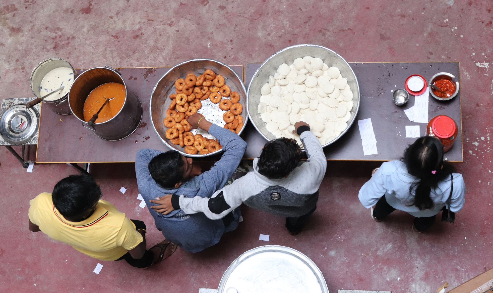 people serving breakfast